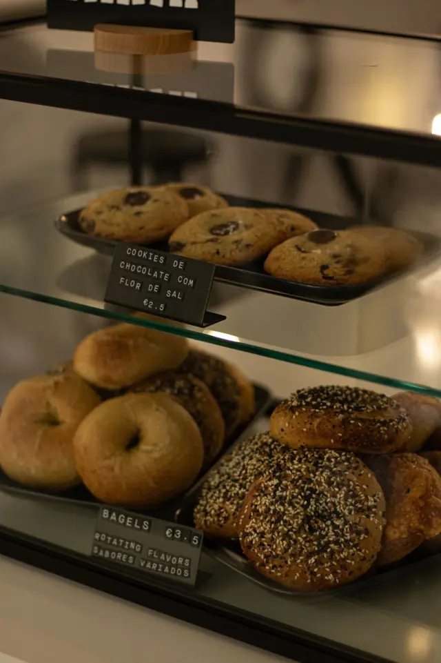 Fresh bagels and chocolate chip cookies in the pastry case